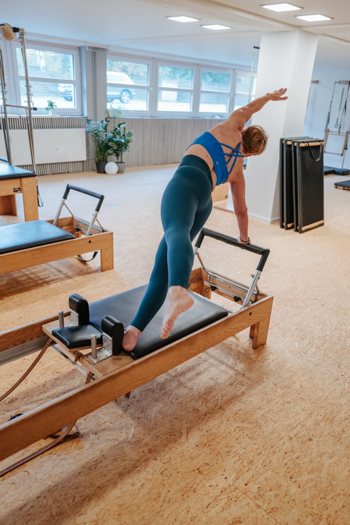 Coach auf Pilates Reformer